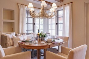 Enjoy meals with family and friends in this cozy dining area, complete with a round table and comfortable seating for four.