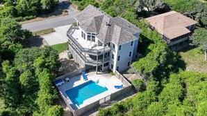A two-story house with a large deck and a swimming pool. - Make Way For Ducklings - Wild Duck Dunes, Ocean Views, 160 Yds to Beach, Saltwater Pool, Flex Stays (Duck)