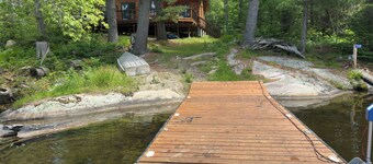 Timber cottage with large deck overlooking the water. Boat access only, no road.
