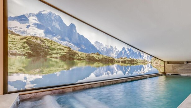 A modern indoor pool with a panoramic mountain view mural. - 1st floor, swimming pool, sauna, balcony, fireplace or stove, parking, tv, ski locker, 71m² (Champagny-en-Vanoise)