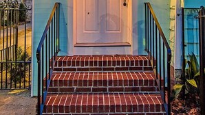 A house with a white front door, number 205, and a brick staircase leading up to it. - The Ashley Suite (Charleston)