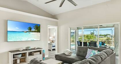 Tropical Gem! Sparkling Saltwater Pool • Peaceful Canal with Dock• Luxe Comfort