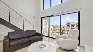 Premium Duplex | Living room | 40-inch flat-screen TV with digital channels