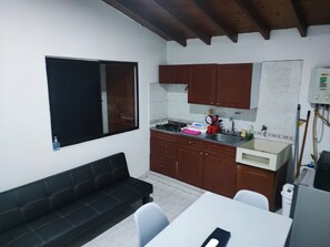 Fridge, microwave, coffee/tea maker, cookware/dishes/utensils
