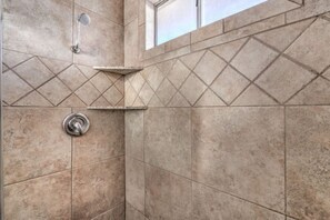 Bathtub, hair dryer, towels, soap