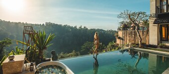 Private villa that offers a view of Mount Agung and lush jungle.