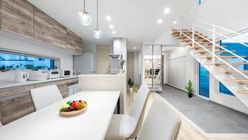 Full-size fridge, microwave, stovetop, electric kettle