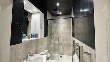 Shower, hair dryer, towels, soap