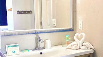 Hair dryer, towels, soap, shampoo