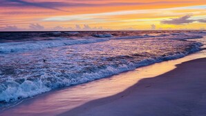 A beach with waves at sunset. - Beach Haven, Game Room, Arcades (Mexico Beach)