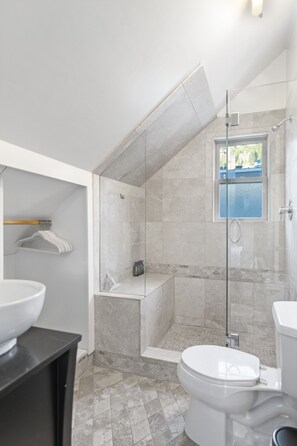 Shower, hair dryer, towels, soap