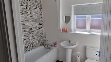 Shower, deep-soaking bathtub, towels