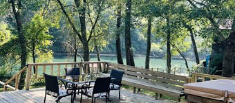 Cozy riverfront cabin with great outdoor space including a hot tub!
