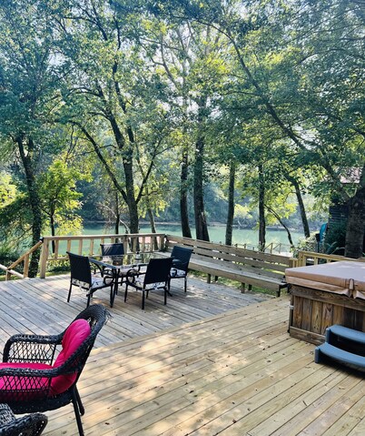 Cozy riverfront cabin with great outdoor space including a hot tub!