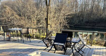 Cozy riverfront cabin with great outdoor space including a hot tub!
