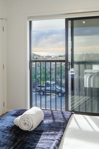 Beachfront 2BR Retreat with Stunning Views