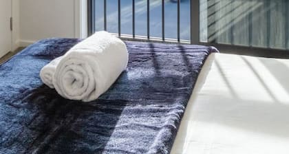 Beachfront 2BR Retreat with Stunning Views