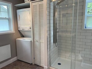 Shower, hair dryer, towels, toilet paper