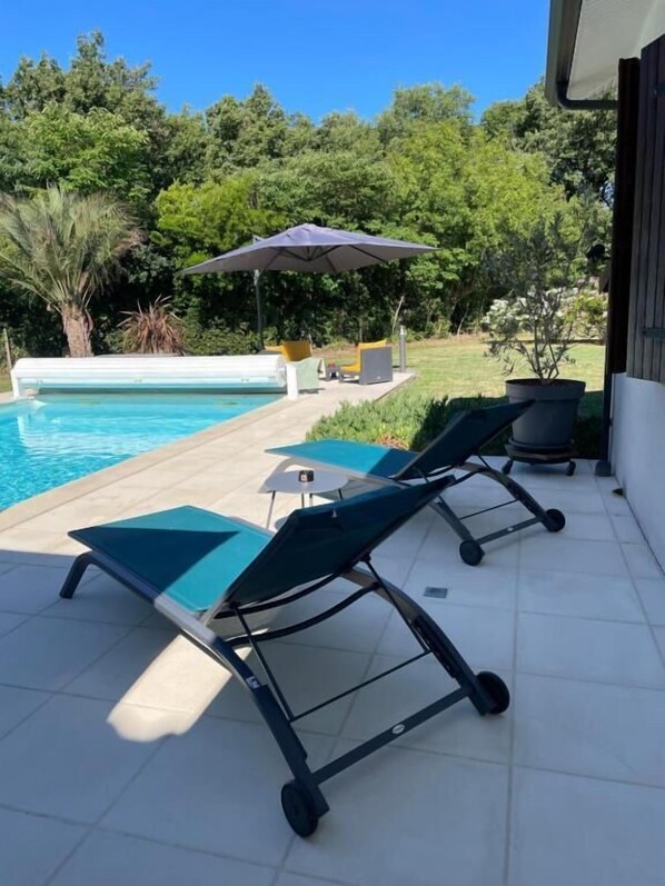 Seasonal outdoor pool, pool umbrellas, pool loungers