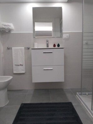 Hair dryer, bidet, towels, soap