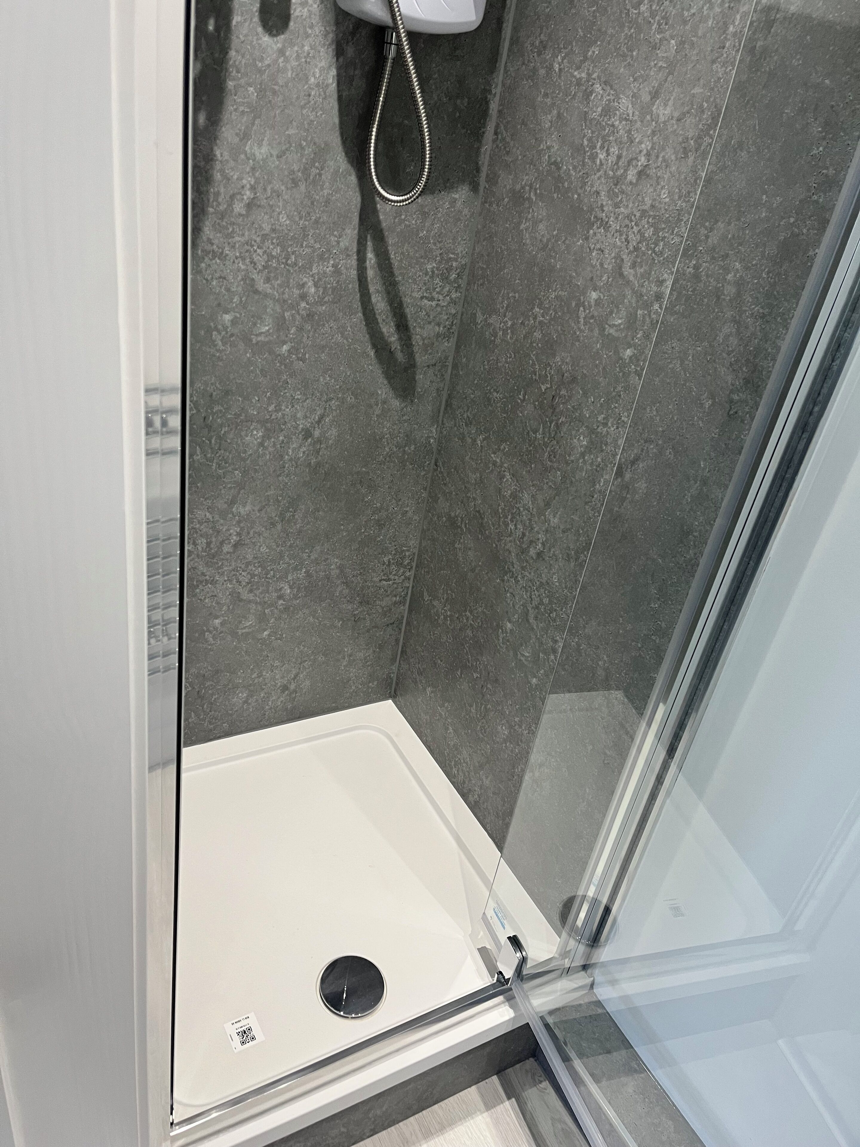 Shower, hair dryer, towels, toilet paper
