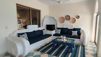 Family Apartment | Living area | 32-inch flat-screen TV with satellite channels