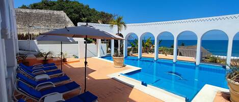 Outdoor pool, open 9:30 AM to 8:00 PM, pool loungers