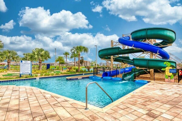 A water park with multiple slides and a pool area. - Modern Comfort 4BR Home with Pool (Kissimmee)