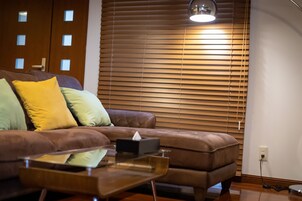 Luxury Apartment | Living area | 50-inch flat-screen TV with cable channels