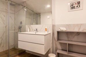 Shower, hair dryer, towels, soap
