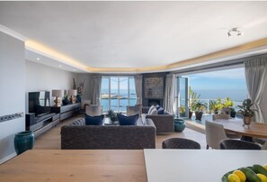 Appartement Luxe, 4 chambres, vue fleuve, en front de mer | Coin séjour