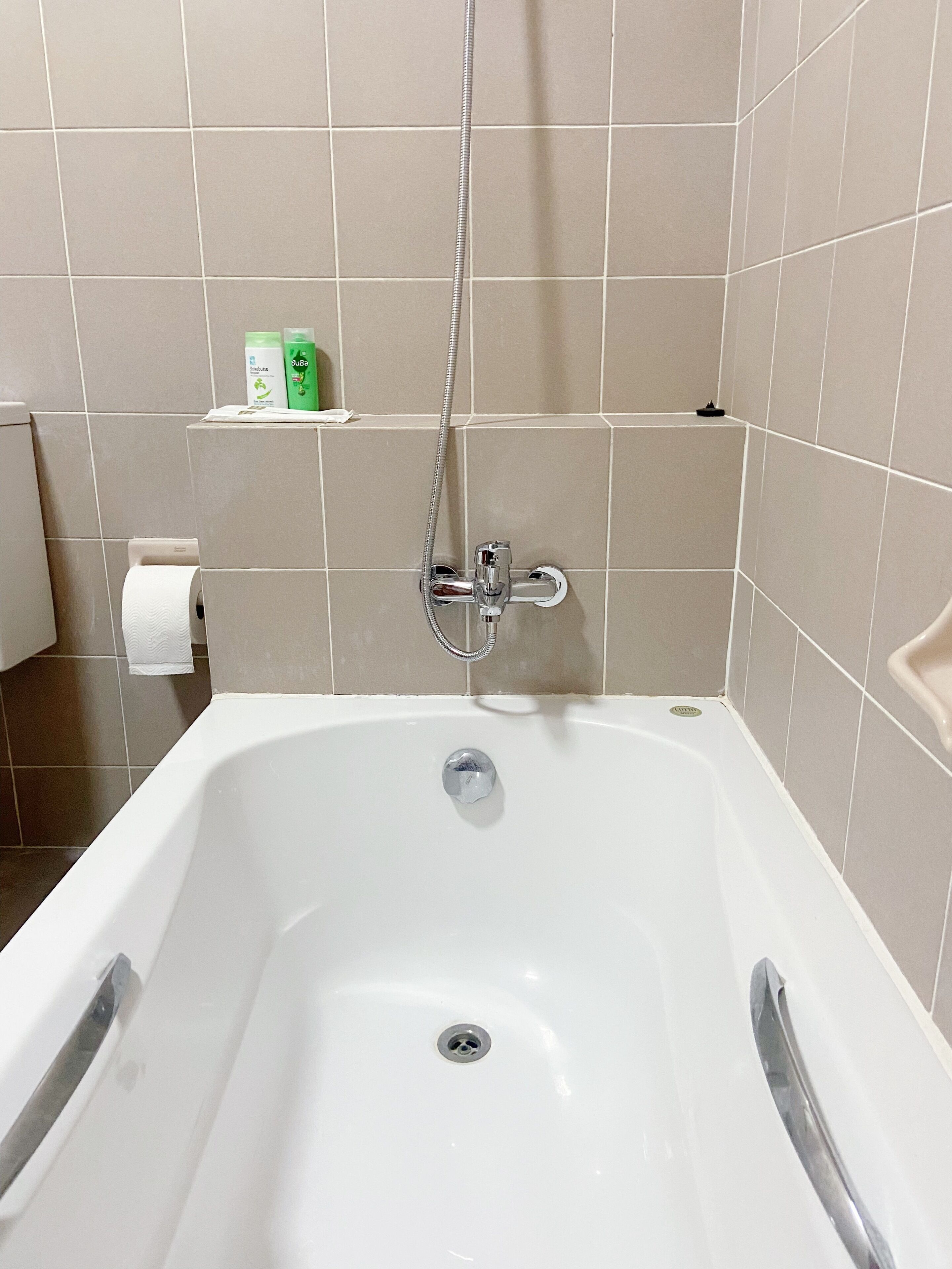 A bathroom with a bathtub, a shower, and a toilet.