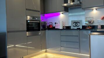 Apartment, 1 Queen Bed | Private kitchen | Fridge, microwave, oven, stovetop