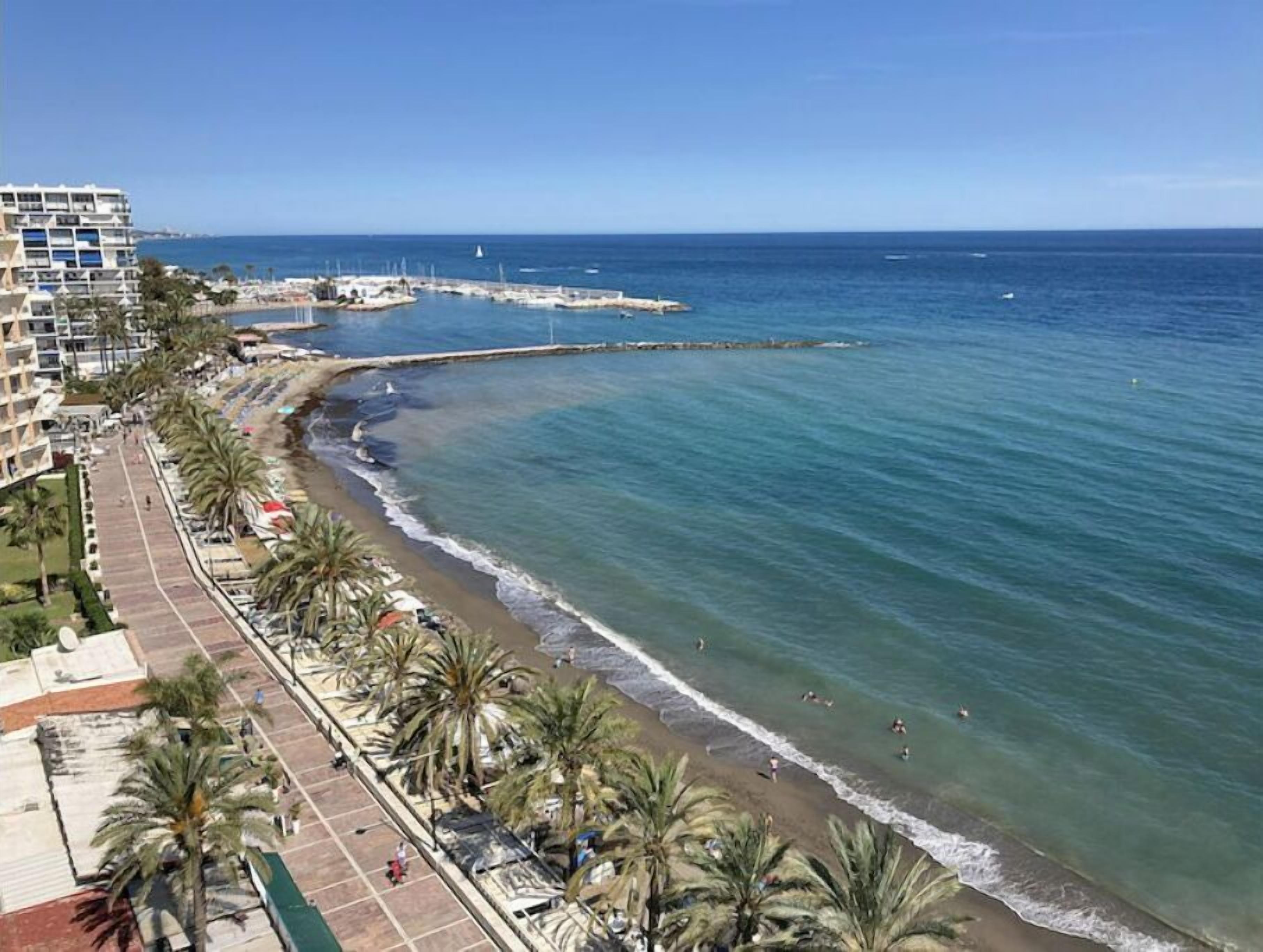 On the beach, sun loungers, beach towels
