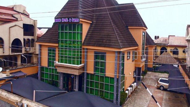 A hotel with a distinctive pyramid roof and large windows. - Biggie Hotel and Suites  (Lagos)