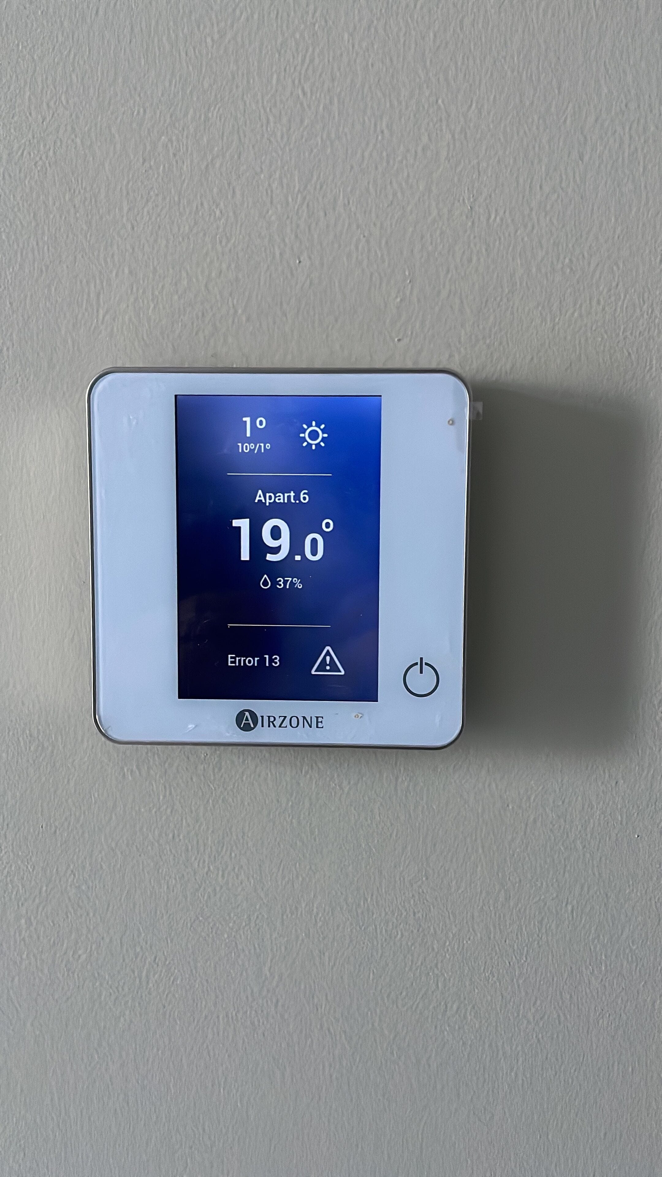A digital thermostat displaying a temperature of 19.0°C, humidity at 37%, and an error code 13.