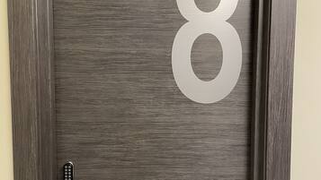 A door with a large number 8 and a keyhole.