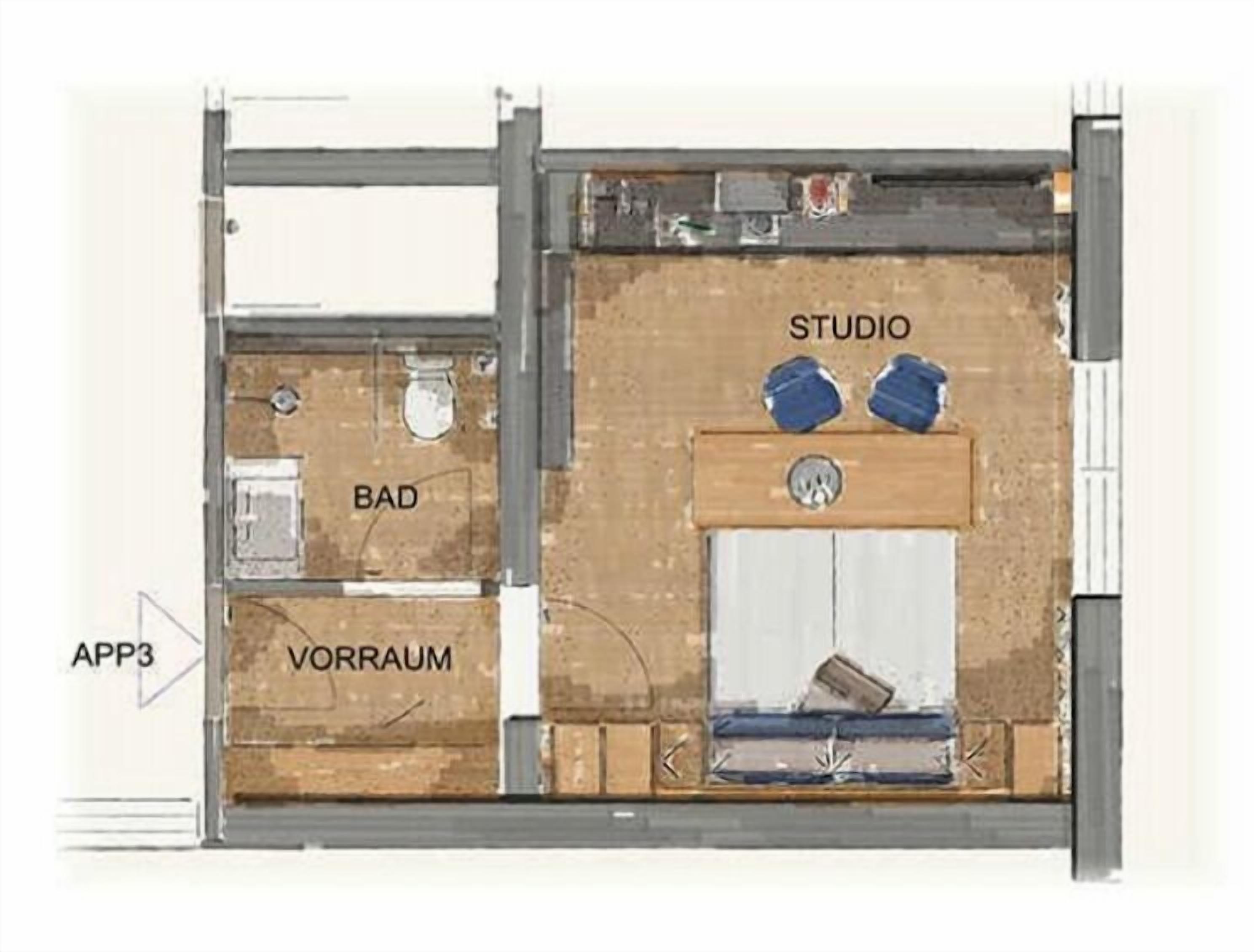 Plano de planta con habitaciones identificadas: 'STUDIO' con dos objetos azules, 'BAD' y 'VORRAUM'.