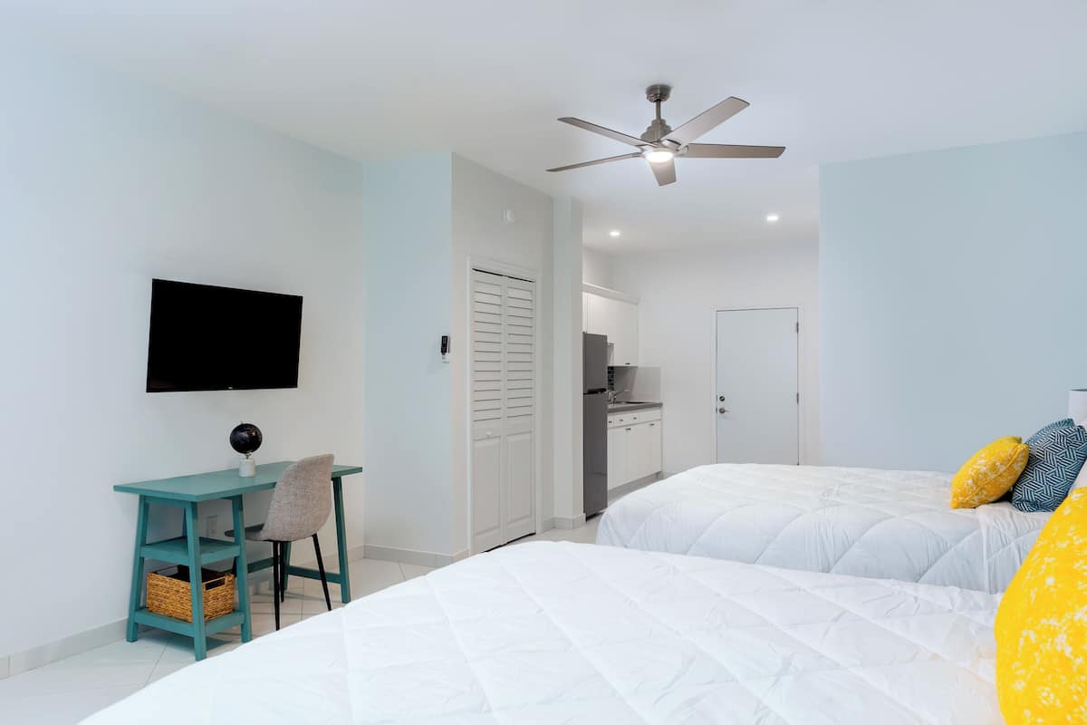 Deluxe Single Room, 2 Double Beds, Balcony | Free minibar, in-room safe, individually decorated