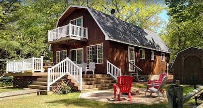 Riverfront cottage steps from Lake Michigan and the Dunes at Silver Lake!