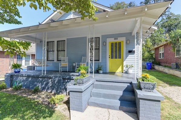 Step out onto the covered porch and enjoy the serene surroundings.