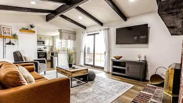 Smart TV, lareira, videogames, livros