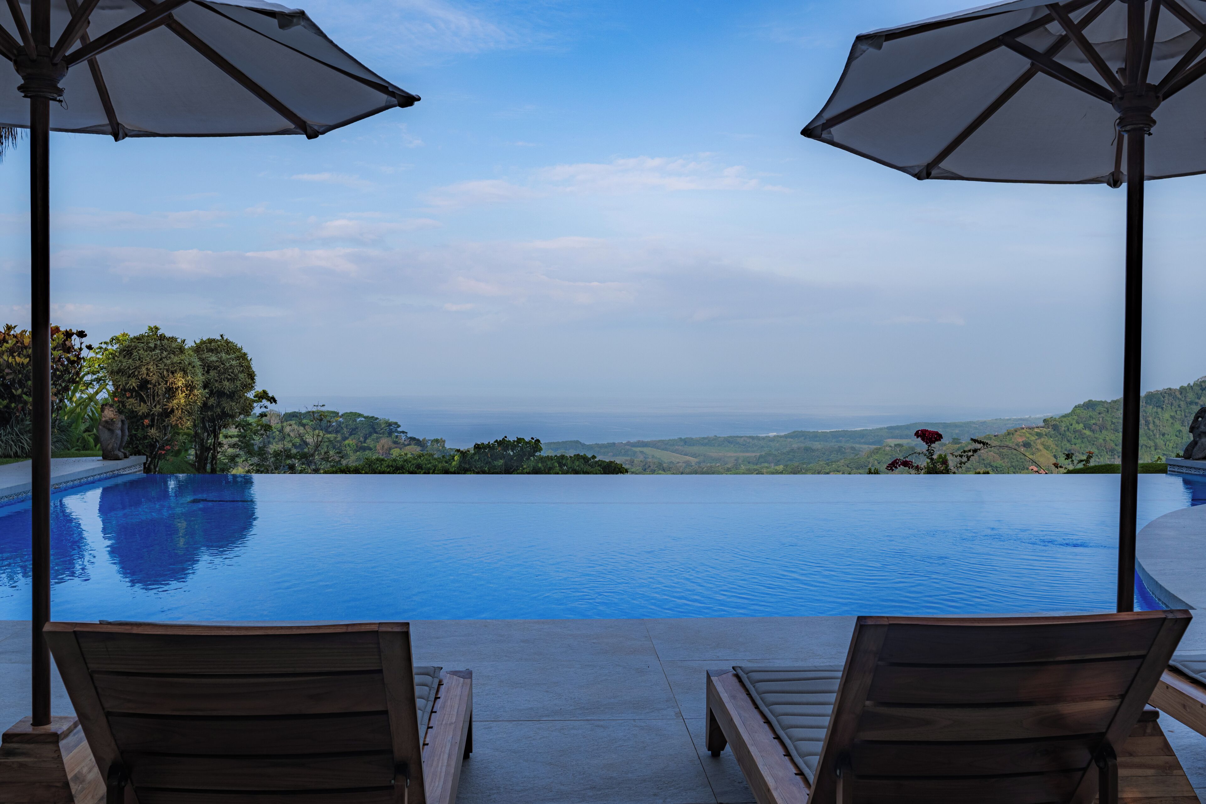 Outdoor pool, pool umbrellas, sun loungers