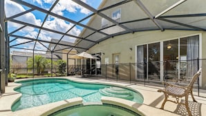A swimming pool with a glass enclosure, a bench, and a covered patio area. - Great Escape to Marbella South (Davenport)