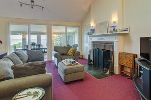 TV, fireplace, DVD player, books - Bayfront Plymouth Gem w/ Sunroom, Steps to Shore! (Plymouth)