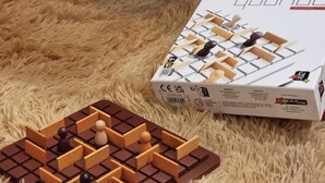 A checkered board game with pieces and a box labeled "Higa". - Condo Unit in Uptown Parksuites T2 Bgc (Taguig)