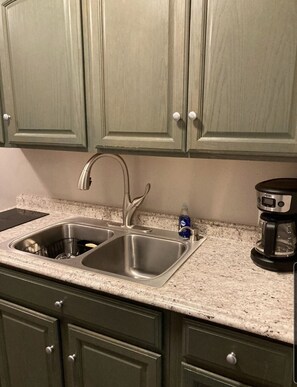 Fridge, microwave, stovetop, coffee/tea maker