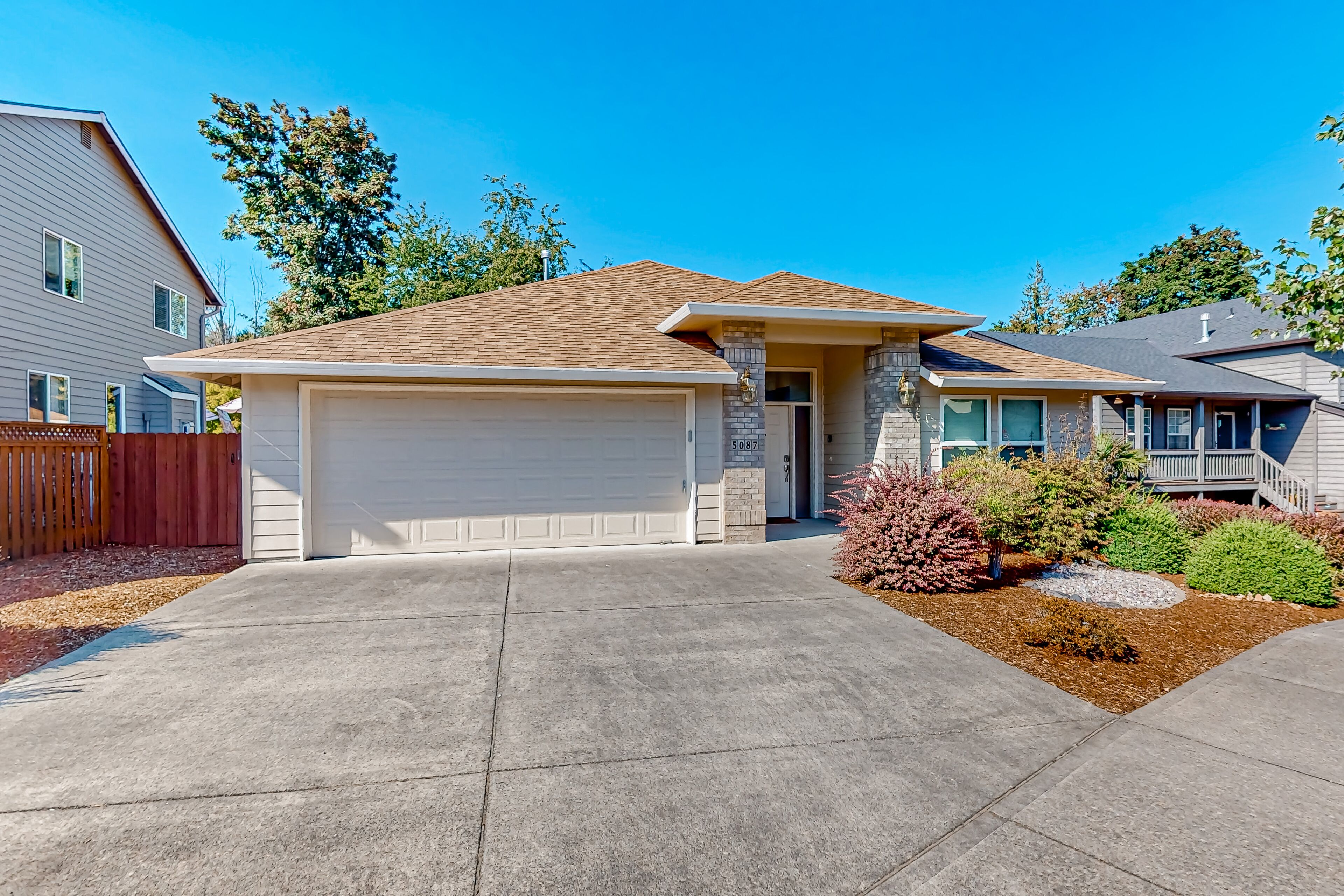 Custom-built home alongside greenspace with deck & massage chairs