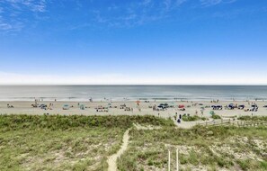 On the beach, sun loungers, beach towels