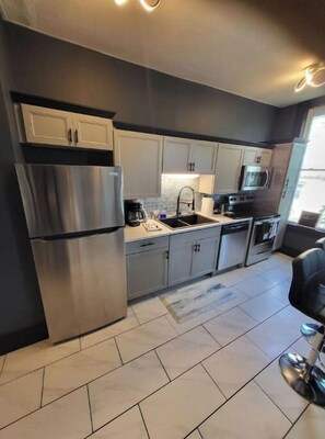 Fridge, coffee/tea maker, cookware/dishes/utensils
